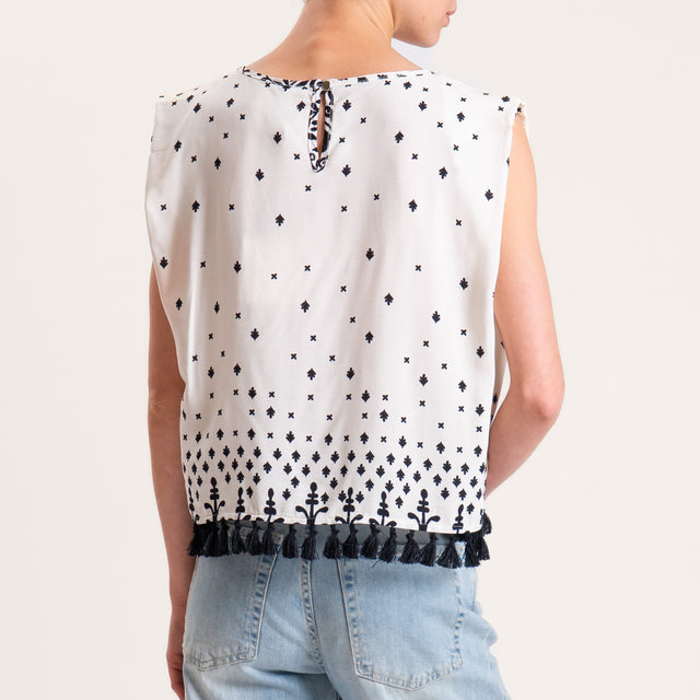 Tensione in-Blusa smanicata fantasia con nappine - burro/nero